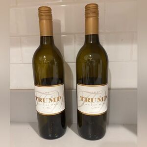 Two Trump empty wine Sauvignon Blanc bottles from Trump Winery for decor use .